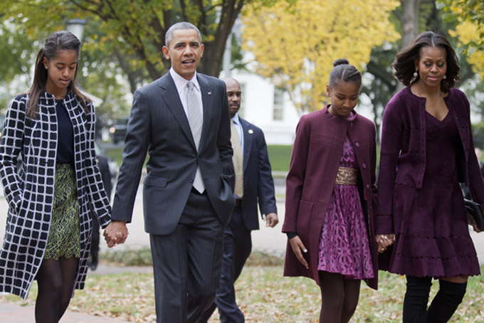 In this Oct. 27, 2013, file photo, President Barack Obama, second from left, with first lady Michelle Obama, right, and their daughters Malia, left, and Sasha, walk from the White House in Washington, to attend a church service. (AP Photo/Manuel Balce Ceneta, File)