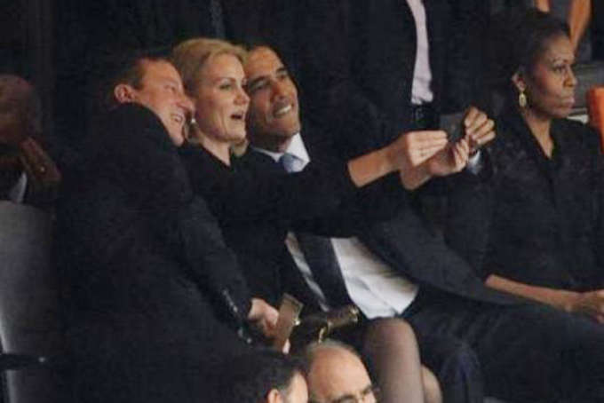 UK Prime Minister David Cameron, Denmark Prime Minister Helle Thorning-Schmidt , and President Barack Obama took a selfie at the memorial service for the late South African President Nelson Mandela. (AP Photo/File)