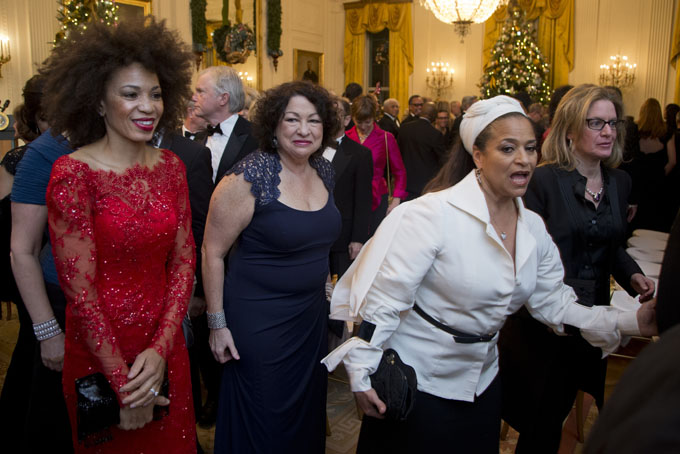 Supreme Court Justice Sonia Sotomayor, center, leaves a reception honoring the 2013 Kennedy Center Honors honorees, in the East Room of the White House in Washington, Sunday, Dec. 8, 2013. (AP Photo/Manuel Balce Ceneta)