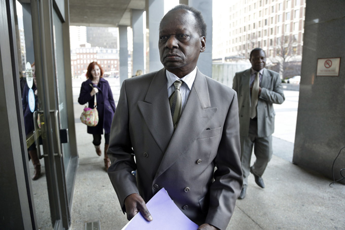 Onyango Obama, President Barack Obama's Kenyan-born uncle, arrives at U.S. Immigration Court for a deportation hearing Tuesday, Dec. 3, 2013 in Boston. He has lived in the United States since the 1960s, when he came here as a teenager to attend school. (AP Photo/Steven Senne)
