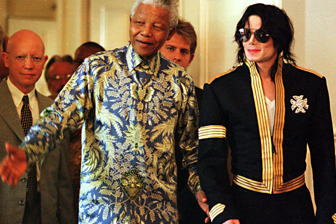 In this March 23, 1999 file photo, South African President Nelson Mandela, left, stands with American pop singer Michael Jackson at a news conference in Cape Town where Jackson announced dates for two concerts in June of which profits will go to various funds including the Nelson Mandela Children's Fund. (AP Photo /Obed Zilwa, File)