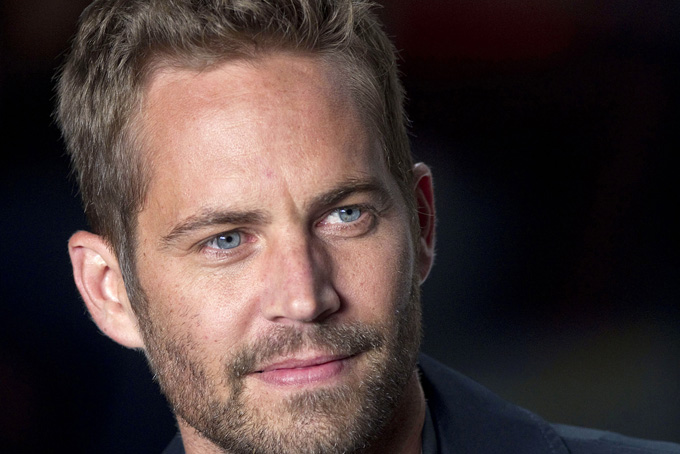 This March 21, 2013 file photo shows actor Paul Walker at Sao Paulo Fashion Week in Sao Paulo, Brazil. (AP Photo/Andre Penner, File)