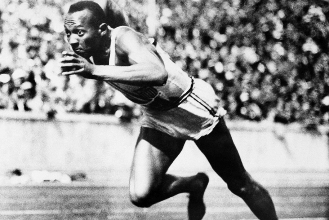 In this Aug. 14, 1936, file photo, Jesse Owens competes in one of the heats of the 200-meter run at the 1936 Olympic Games in Berlin. One of the four Olympic gold medals won by Owens at the 1936 Berlin Games is for sale in an online auction that runs from through Dec. 7. (AP Photo/File)