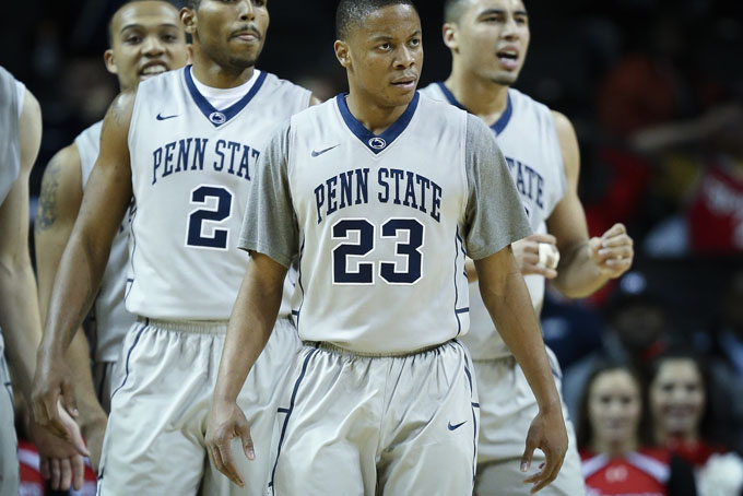 Penn State guard Tim Frazier (23) looks towards the bench alongside guard D.J. Newbill (2) and forward Ross Travis (43) in the first half of a NCAA college basketball game against St. John's during the Barclays Center Classic, Friday, Nov. 29, 2013, in New York. Penn State won, 89-82. (AP Photo/John Minchillo)