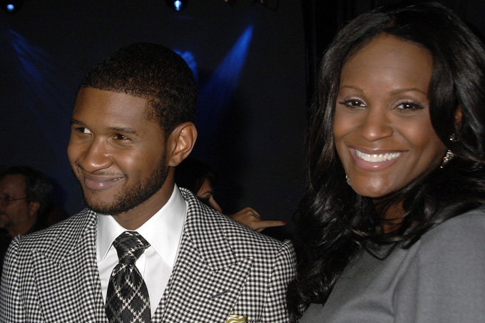 In this Sept. 25, 2007 file photo, Grammy award winner Usher Raymond and wife his Tameka Foster mingle at a party for the unveiling of Usher's new fragrances, Usher for Men and Usher for Women, in New York. (AP Photo/John Smock, file)