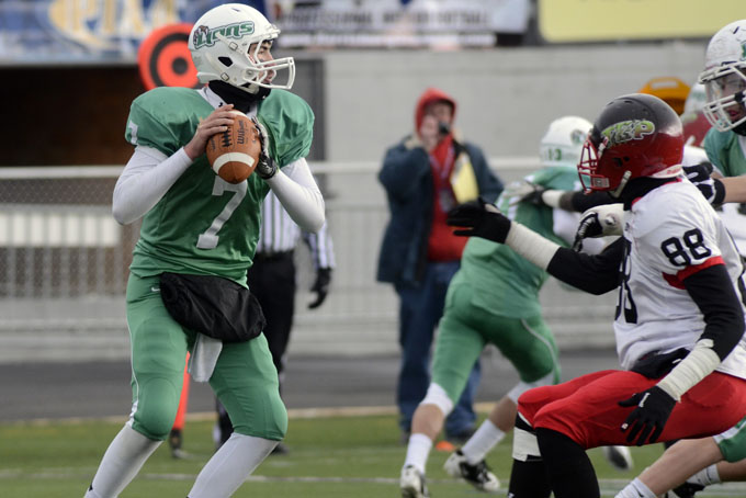 South Fayette quarterback Brett Brumbaugh (7) looks for a receiver during the first half of a PIAA high school Class AA championship football game in Hershey, Pa., Sunday, Dec. 15, 2013. (AP Photo/Ralph Wilson)