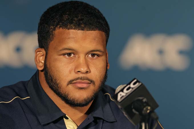 In this July 21, 2013 file photo, Pittsburgh's Aaron Donald speaks during the Atlantic Coast Conference Media Day in Greensboro, N.C. Donald's dominant season earned the Pittsburgh defensive lineman four major college football awards and a spot as a first-team All-American. There's still one more thing on his checklist: helping the Panthers win next week's Little Ceasar's Bowl. (AP Photo/Chuck Burton, File)