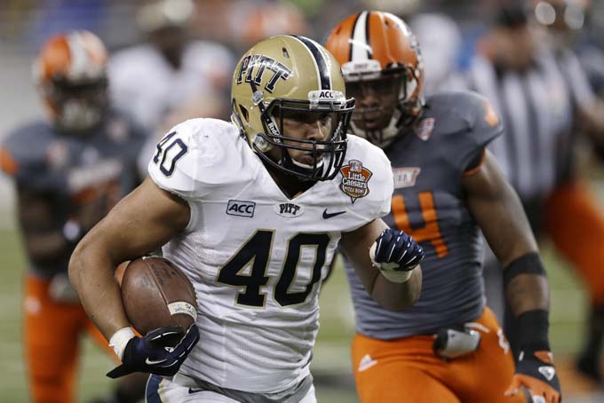 Pittsburgh running back James Conner (40) rushes during the second half of the Little Caesars Pizza Bowl NCAA college football game against Bowling Green, Thursday, Dec. 26, 2013, in Detroit. (AP Photo/Carlos Osorio)