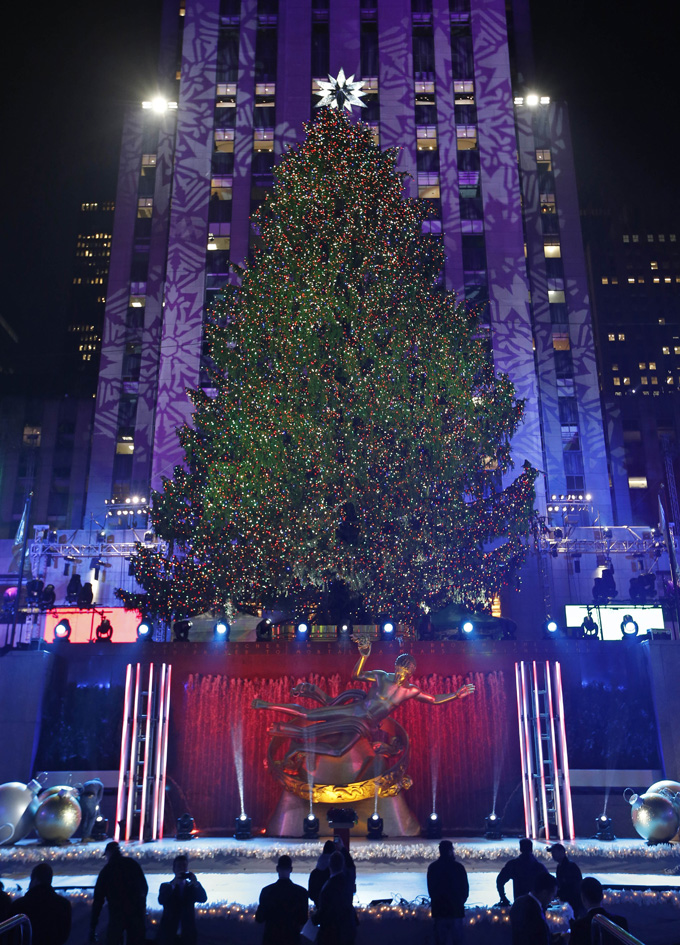  The Rockefeller Center Christmas tree shines, Wednesday, Dec. 4, 2013, in New York. Some 45,000 energy efficient LED lights adorn the 76-foot tree. (AP Photo/Kathy Willens)