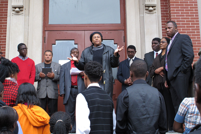 George Stinney's second cousin Irene Lawson-Hill, center, tells a crowd her family won't stop fighting, at a rally to call for justice for George Stinney on Tuesday, Dec. 10, 2013, in Manning, S.C. (AP Photo/Jeffrey Collins)
