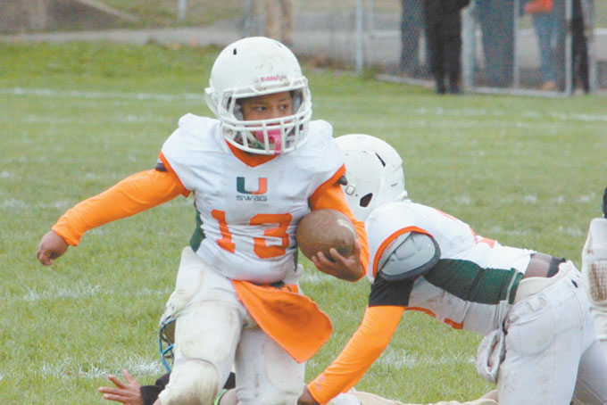 TREY MONTGOMERY (13) 9 years old carried the ball many times for a lot of yards but still was not enough for the win. 
