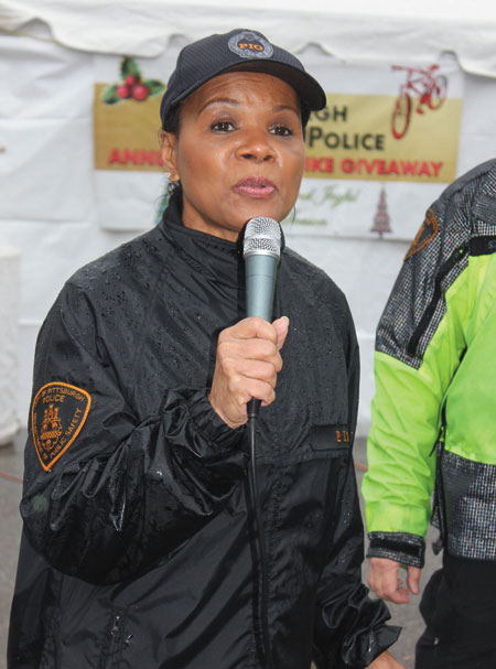 WELCOME—Pittsburgh Bureau Police Public Officer Diane Richard welcomes students and their families to the PBP’s 13th annual Holiday Bike Giveaway.