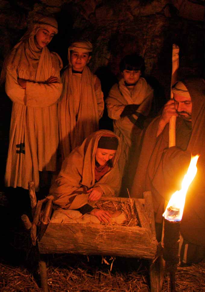 In this Saturday, Dec. 22, 2007 file photo, Tara Kreider, left, of Harrisonburg, Va., portraying Mary, and Israeli Arab Christian Samir Hawa, right, as Joseph, take part in a Nativity scene during a re-enactment by Israeli Arab Christians and foreigners of the journey to Bethlehem and the birth of Jesus Christ as part of Christmas festivities in the northern Israeli city of Nazareth. According to the Bible, Nazareth was the home of Joseph and Mary, the mother and father of Jesus, and the site of the Annunciation when she was told by the Angel Gabriel that she would give birth to Jesus, who was born in Bethlehem, in the modern-day West Bank. (AP Photo/Kevin Frayer, File)