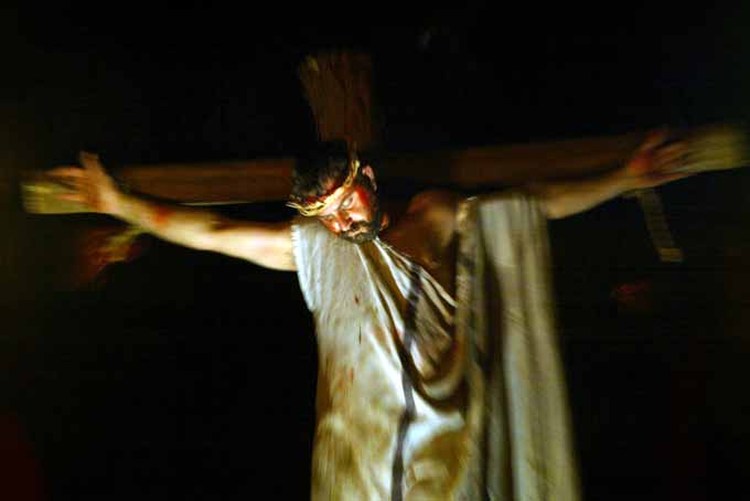 In this Wednesday, April 7, 2004 file photo, Samir Hawa, 33, an Israeli Arab Christian, wears a crown of thorns as he re-enacts Jesus Christ's crucifixion in "Nazareth Village," a life-size replica of the first century farming village, in the northern Israeli Arab town of Nazareth. According to the Bible, Jesus was born in Bethlehem, in the modern-day West Bank. (AP Photo/Lefteris Pitarakis, File)