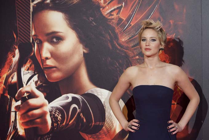 In this Nov. 13, 2013 file photo, actress Jennifer Lawrence poses for the photographers during the premiere of the movie "The Hunger Games: Catching Fire" at Callao Cinema in Madrid, Spain. (AP Photo/Abraham Caro Marin, File)