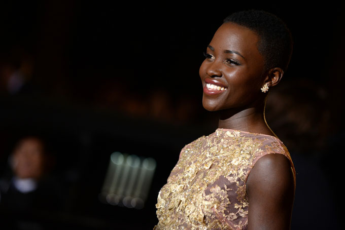 Lupita Nyong'o arrives at the Palm Springs International Film Festival Awards Gala at the Palm Springs Convention Center on Saturday, Jan. 4, 2014, in Palm Springs, Calif. (Photo by Jordan Strauss/Invision/AP)