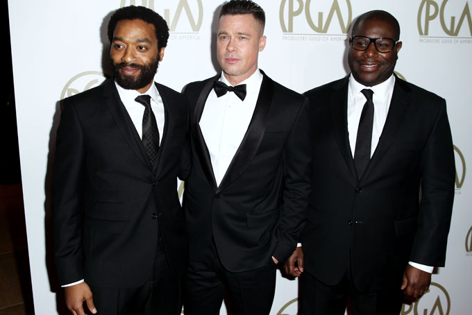 Steve McQueen, right, Chiwetel Ejiofor, left, and Brad Pitt arrive at the 25th annual Producers Guild of America Awards at the Beverly Hilton Hotel in Beverly Hills, Calif. on Sunday, Jan. 19, 2014. (Photo by Matt Sayles/Invision/AP)