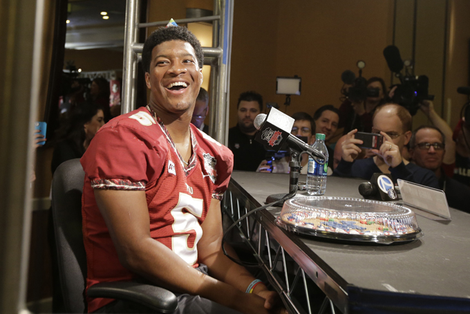 Florida State's Jameis Winston wears a birthday hat as he answers a question during media day for the NCAA BCS National Championship college football game Saturday, Jan. 4, 2014, in Newport Beach, Calif. (AP Photo/David J. Phillip)