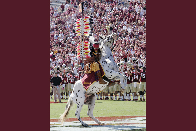 Florida State's mascot chief Osceola aboard Renegade plants the spear to begin an NCAA college football game against Maryland in Tallahassee, Fla. In a football season shadowed by controversy over the Washington Redskins nickname, nary a word has been heard out of Tallahassee, Fla., where the local university's mascot is, in some minds, every bit as inappropriate. (AP Photo/Steve Cannon, File)