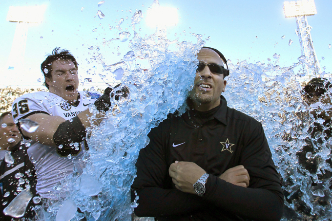 In this Saturday, Jan. 4, 2014 file photo, Vanderbilt coach James Franklin is doused by linebacker Chase Garnham (36) after they defeated Houston 41-24 in the BBVA Compass Bowl NCAA college football game in Birmingham, Ala. "We’re making tremendous strides," Franklin says. "The more opportunities that coaches get and go out and do well and succeed, it helps. It helps change perceptions, and perceptions are a powerful thing." (AP Photo/Butch Dill)