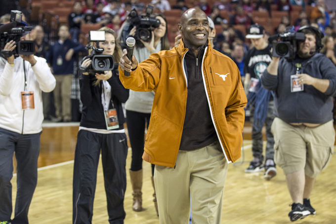 In this Wednesday, Jan. 8, 2014 file photo, Texas new head football coach Charlie Strong speaks to fans during a timeout against Oklahoma in the first half of an NCAA college basketball game in Austin, Texas. (AP Photo/Austin American- Statesman, Ricardo B. Brazziell) 