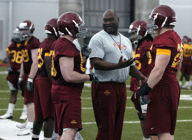 Iowa State defensive line coach Curtis Bray, center, talks with players during drills at the Bergstrom Indoor Practice Facility in Ames, Iowa.  (AP Photo/Ronnie Miller, Ames Tribune/File)   