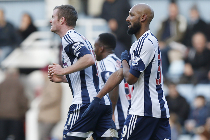 This is a Saturday, Dec. 28, 2013. file photo of West Bromwich Albion's Nicolas Anelka, right, as he gestures to celebrates his goal against West Ham United during their English Premier League soccer match at Upton Park, London. (AP Photo/Sang Tan, File)