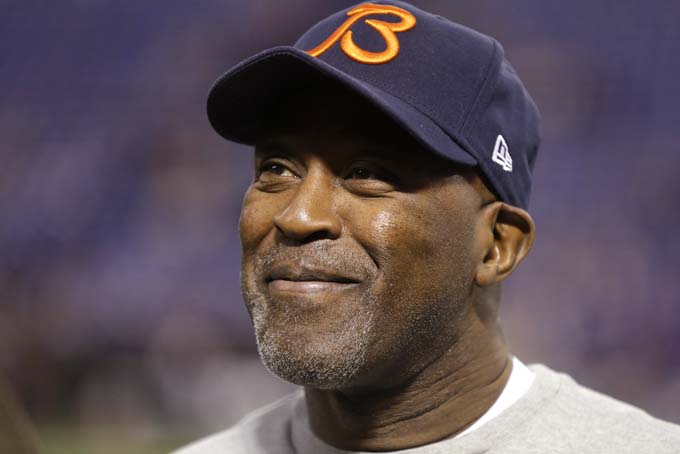 In this Dec. 9, 2012, photo, Chicago Bears coach Lovie Smith smiles before the Bears' NFL football game against the Minnesota Vikings in Minneapolis. (AP Photo/Charlie Neibergall)
