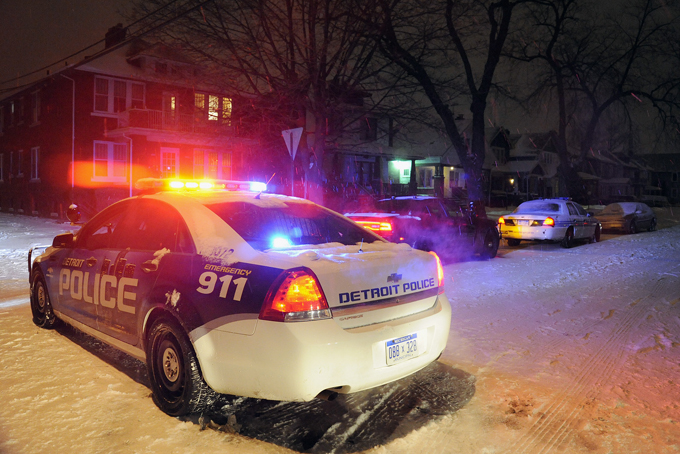 A Detroit Police vehicle is parked in the neighborhood where a four year old boy was shot with a rifle on Thursday, Jan. 16, 2014 in Detroit. (AP Photo/Detroit News, Jose Juarez) 