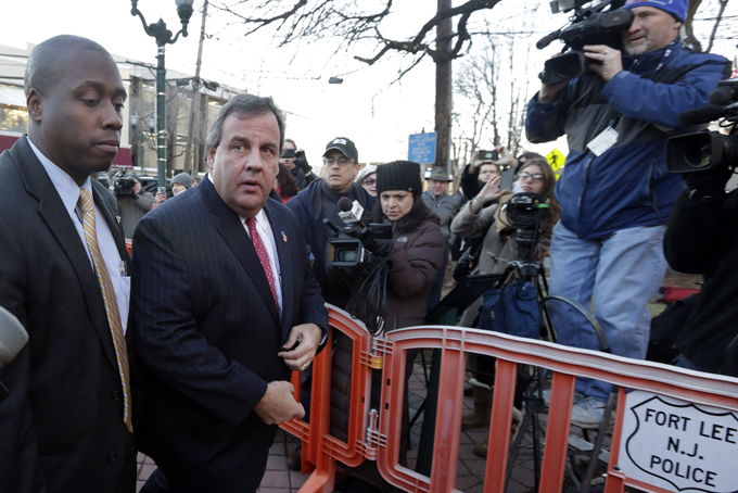 In this Jan. 9, 2014 file photo, New Jersey Gov. Chris Christie, second left, arrives at Fort Lee, N.J., City Hall. Christie traveled to Fort Lee to apologize in person to Mayor Mark Sokolich. (AP Photo/Richard Drew, File)