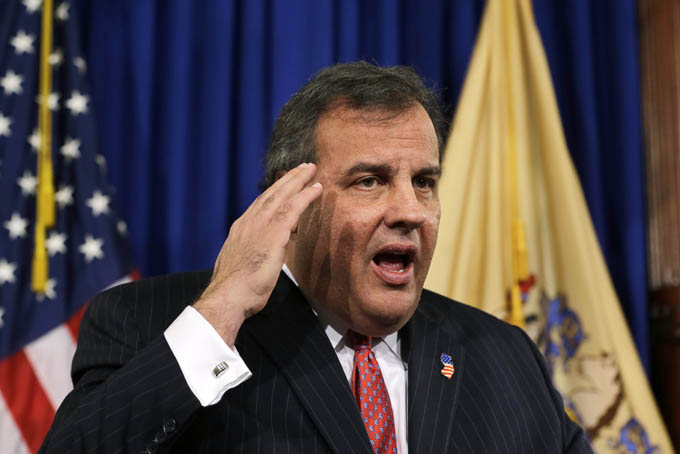 New Jersey Gov. Chris Christie gestures as he answers a question during a news conference Thursday, Jan. 9, 2014, at the Statehouse in Trenton. Christie has fired a top aide who engineered political payback against a town mayor, saying she lied. Deputy Chief of Staff Bridget Anne Kelly is the latest casualty in a widening scandal that threatens to upend Christie's second term and likely run for president in 2016. Documents show she arranged traffic jams to punish the mayor, who didn't endorse Christie for re-election. (AP Photo/Mel Evans)