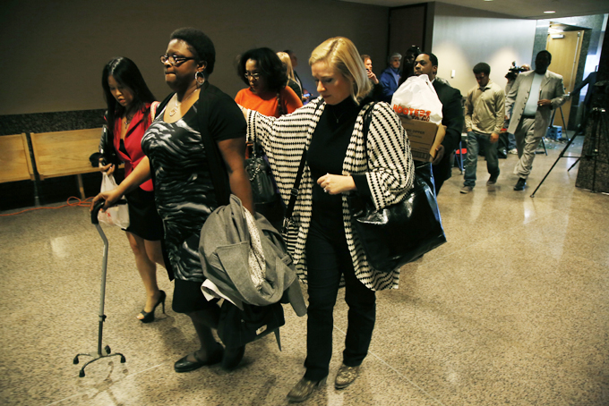 LaTasha Brent, center, the mother of former Dallas Cowboys NFL football player Josh Brent, walks to an elevator with a member her son's defense team after he was found guilty of intoxication manslaughter Wednesday, Jan. 22, 2014, in Dallas, for a fiery wreck that killed his teammate and close friend, Jerry Brown. (AP Photo/The Dallas Morning News,  Nathan Hunsinger)  