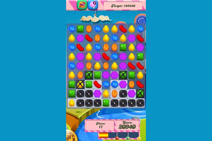 This undated screenshot shows Candy Crush Saga, the maddeningly addictive mobile game that involves matching bright-hued virtual candies in a row to have them disappear, only to be replaced by more. (AP Photo/Candy Crush)