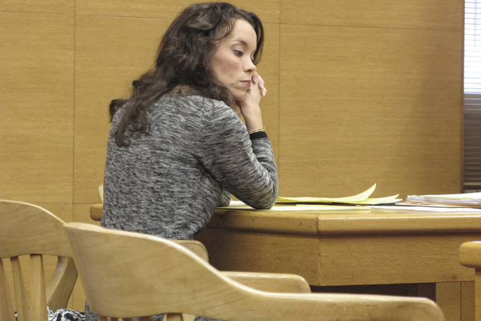 Lynnett Gorman sits in court , Wednesday, Jan. 8, 2014 in Steubenville, Ohio. Gorman, an eastern Ohio elementary school official, will perform community service related to rape awareness in exchange for prosecutors dropping a charge that she failed to report rumors of a teenage sex and drinking party, state Attorney General Mike DeWine announced Wednesday. Gorman had faced a misdemeanor charge of failure to report child abuse or neglect related to the April 2012 party. (AP Photo/Steubenville Herald-Star, Mark Law)