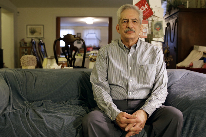 In this Jan. 10, 2014 photo, Stan Osnowitz poses in his living room in Baltimore. (AP Photo/Patrick Semansky)