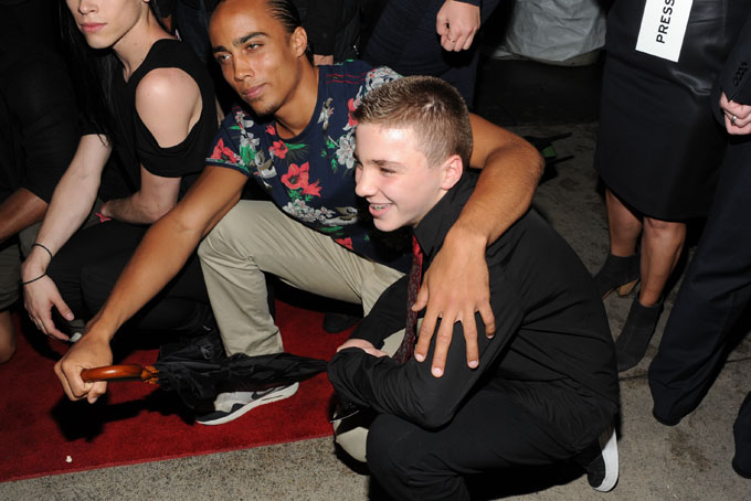 In this Tuesday, June 18, 2013 file photo, Madonna's son, Rocco Ritchie, foreground, attends the world premiere of "Madonna: The MDNA Tour" at the Paris Theatre in New York. Madonna is apologizing for using a racial slur to refer to her white son Instagram. On Friday night, Jan. 17, 2014, she posted a picture of her 13-year-old son boxing and used a hashtag that contained a racial slur. When fans objected, she defiantly called them haters, but in a statement to The Associated Press on Saturday, Jan. 18, 2014, she was contrite and said: "Forgive me." (Photo by Evan Agostini/Invision/AP)