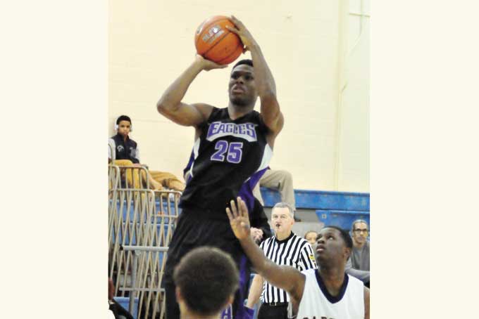 MARCUS JOHNSON of USO goes up for a shot against Carrick, Johnson chipped in with 10 points in the Eagles 82-55 win