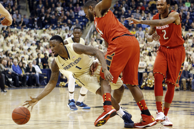 Pittsburgh's Jamel Artis (1) tries to control the ball as he drives around Maryland's Shaquille Cleare, center, in the first half of an NCAA college basketball game on Monday, Jan. 6, 2014, in Pittsburgh. (AP Photo/Keith Srakocic)