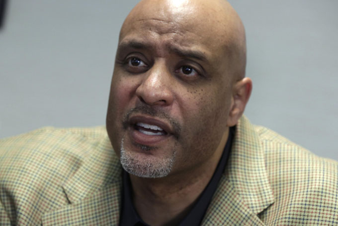 New baseball union head Tony Clark is interviewed at the organization's headquarters, in New York, Wednesday, Jan. 15, 2014. Clark says players won't agree to terminating contracts as part of discipline for drug violations. Clark took over as the union's executive director following the death of Michael Weiner in November. (AP Photo/Richard Drew)