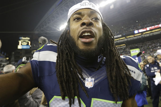 Seattle Seahawks' Richard Sherman celebrates after the NFL football NFC Championship game against the San Francisco 49ers, Sunday, Jan. 19, 2014, in Seattle. The Seahawks won 23-17 to advance to Super Bowl XLVIII. (AP Photo/Elaine Thompson)