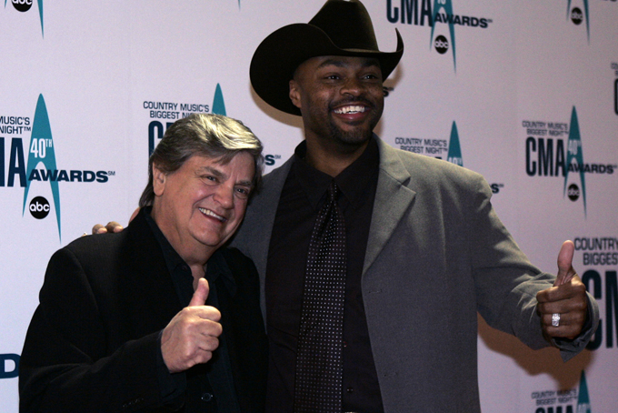 In this Nov. 6, 2006 file photo, Phil Everly, left, and Cowboy Troy arrive at the 40th Annual CMA Awards in Nashville, Tenn. (AP Photo/Chitose Suzuki, File)