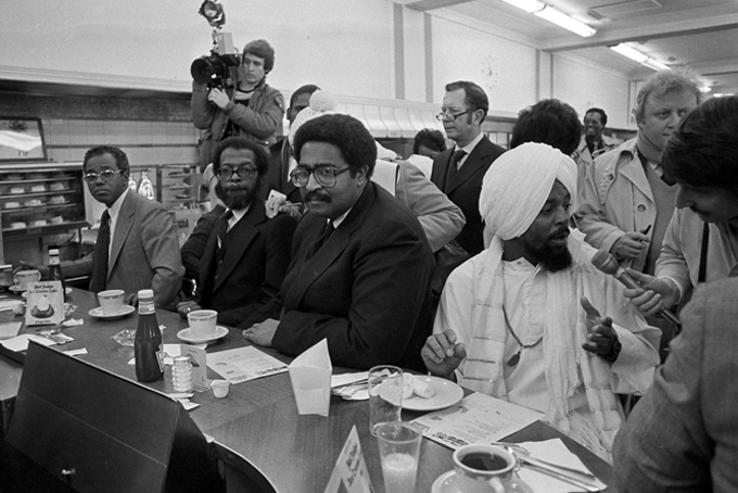 In a Feb. 1, 1980 file photo, former North Carolina A & T students, left to right, Joseph McNeill, David Richmond, Franklin McCain and Jibreel Khazan, sit at the F.W. Woolworth lunch counter in Greensboro, N.C., as they celebrate the 20th anniversary of their historic sit-in. The four were not served in 1960 but their action launched the sit-in movement in more than nine states. (AP Photo/Bob Jordan, File)