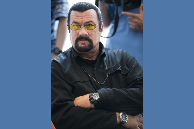 This June 2, 2013, file photo shows actor Steven Seagal looking on as he waits for a news conference of U.S. Congressional delegation to Russia in U.S. Embassy in Moscow, Russia. (AP Photo/Alexander Zemlianichenko, File)