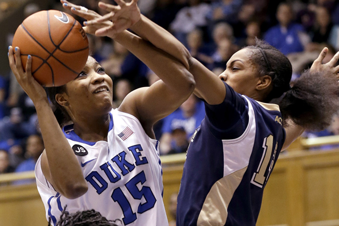 Duke's Richa Jackson (15) drives between Pittsburgh's Loliya Briggs, left, and Marquel Davis during the first half of an NCAA college basketball game in Durham, N.C., Sunday, Jan. 26, 2014. (AP Photo/Gerry Broome)