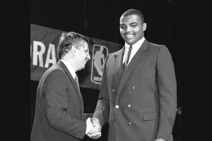 In this June 19, 1984, file photo, NBA Commissioner David Stern, left, shakes Charles Barkley's hand in New York, after the former Auburn University forward was drafted by the Philadelphia 76ers. Barkley was picked fifth in the NBA draft.  (AP Photo/Marty Lederhandler, File)