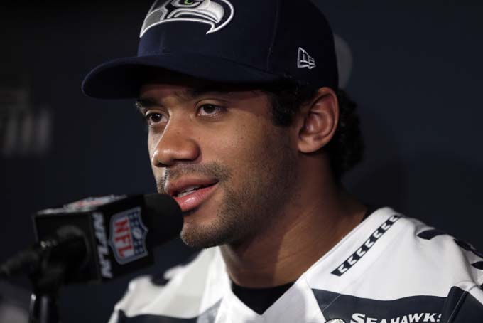  Seattle Seahawks quarterback Russell Wilson answers questions during a media availability Thursday, Jan. 30, 2014, in Jersey City, N.J. The Seahawks and the Denver Broncos are scheduled to play in the Super Bowl XLVIII football game Sunday, Feb. 2, 2014. (AP Photo)   