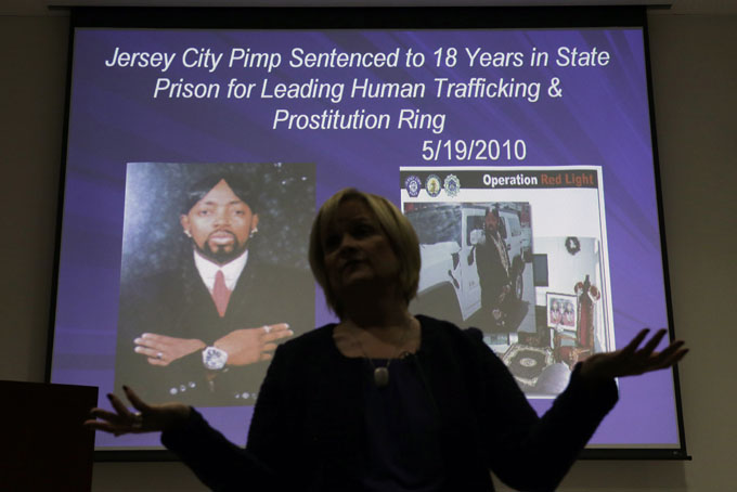In this Thursday, Dec. 19, 2013 photograph, Kathleen Friess gives a presentation on human trafficking in Hamilton Township, N.J., for hotel and nightclub employees and tries to dispel notions of what human trafficking looks like. Often, Friess said, it’s a local woman forced into sex work by a man she initially thought had romantic intentions.  (AP Photo/Mel Evans)