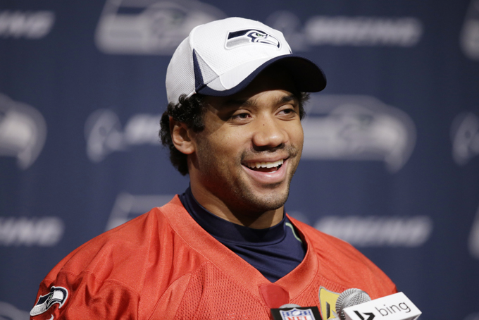 Seattle Seahawks quarterback Russell Wilson speaks at an NFL football news conference Wednesday, Jan. 22, 2014, in Renton, Wash. The Seahawks play the Denver Broncos in the Super Bowl on Feb. 2. (AP Photo/Elaine Thompson)