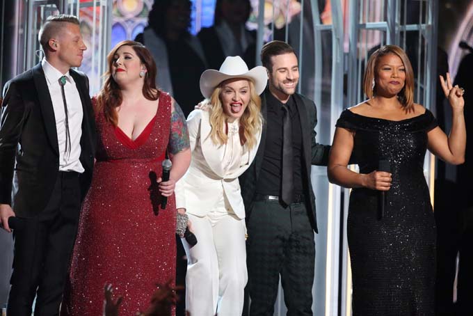 Performers, from left, Macklemore, Mary Lambert, Madonna, Ryan Lewis and Queen Latifah appear on stage during a performance of "Same Love" at the 56th annual Grammy Awards at Staples Center on Sunday, Jan. 26, 2014, in Los Angeles. (Photo by Matt Sayles/Invision/AP)