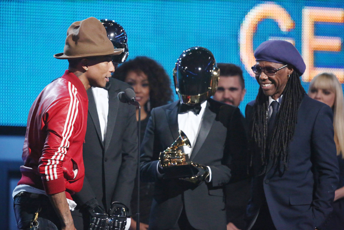 Pharrell Williams, from left, Daft Punk and Nile Rodgers accept the award for best pop duo/group performance at the 56th annual Grammy Awards at Staples Center on Sunday, Jan. 26, 2014, in Los Angeles. (Photo by Matt Sayles/Invision/AP)